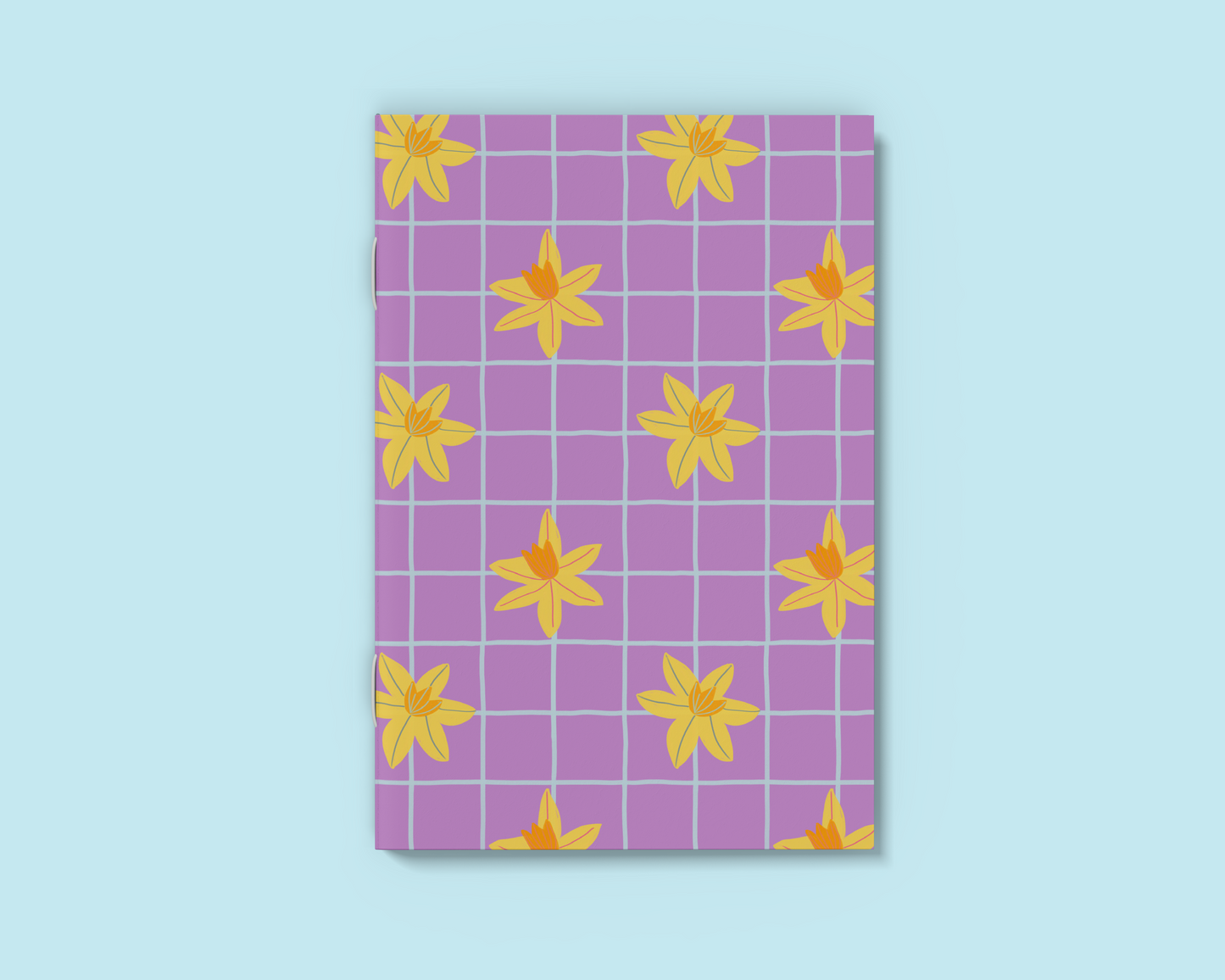 A6 Purple notebook with hand drawn daffodil and blue grid