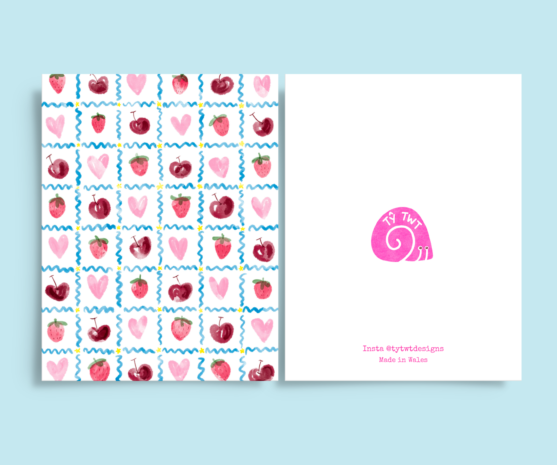 Featuring a hand illustrated grid of strawberries, cherries, hearts, squiggles, and stars. Back of card Instagram @tytwtdesigns made in Wales