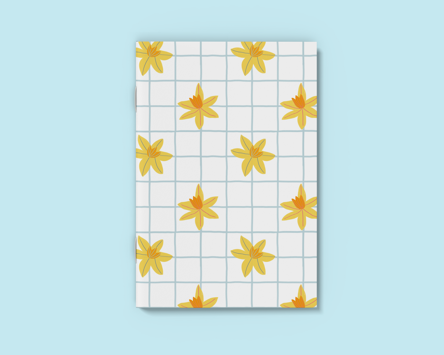 A6 White notebook with hand drawn daffodil and blue grid
