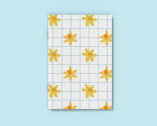 A6 White notebook with hand drawn daffodil and blue grid