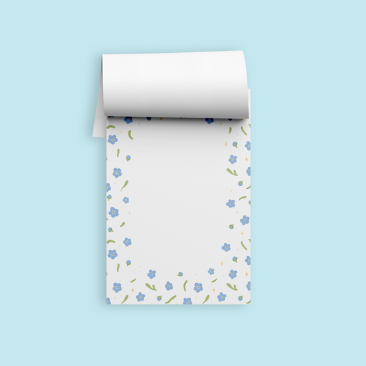 A6 notepad with a cute forget me nots, leaves, and stars. 50 pages, thick paper, eco-friendly