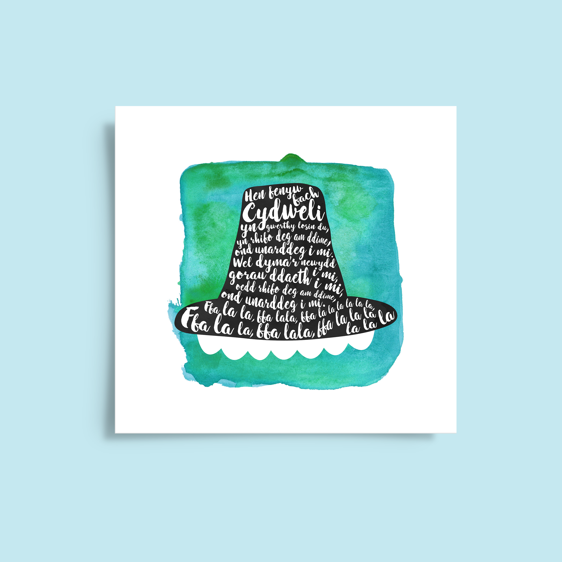 A tribute to one of Wales’ most beloved songs, this print features Hen Fenyw Bach lyrics in a Het Gymreig 'Welsh Hat' blue watercolour design.