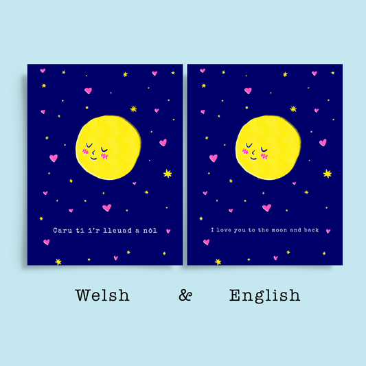 Blue background with English and Welsh versions of romantic greeting card. On the dark blue card is risograph print of a blushing moon amongst stars and hearts, Typewriter text below reads Caru ti ir lleuad a nôl, Welsh for I love you to the moon and back. 