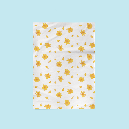 Fair trade cotton tea towels with hand drawn daffodil patterns. Eco-friendly and ethically made.