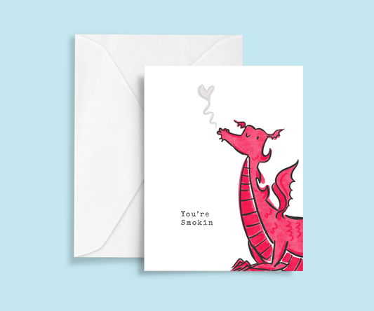 Featuring a hand illustrated print of a Welsh red dragon, puffing smoke with typewriter text reading 'you're smokin'"